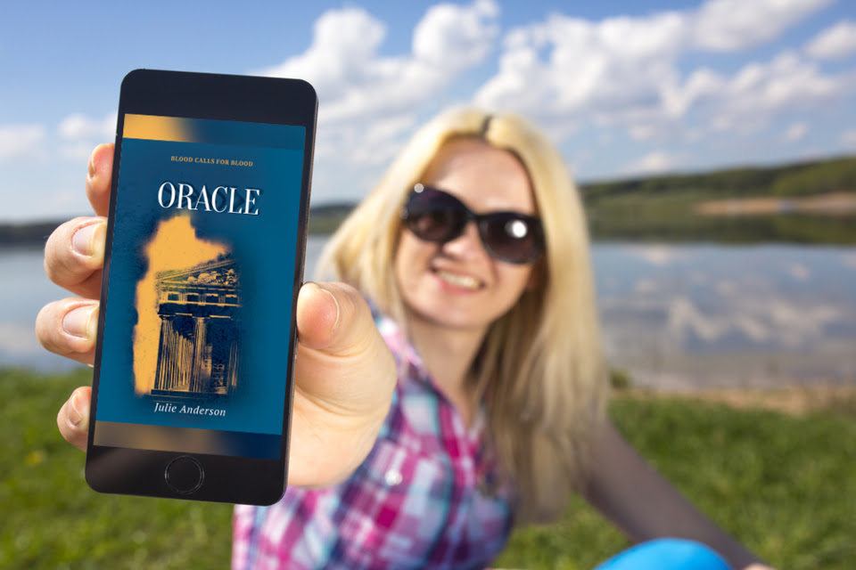 Oracleonphoneheldbywomanatlake